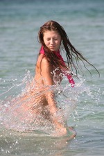 Teen girl gets naked at the beach-15