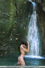 Naked babe by the waterfall-00
