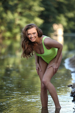Naked brunette posing at the lake-00