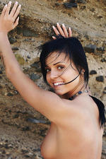 Black haired teen posing by the rocks-04