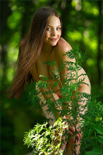 Amelie getting naked in an emerald forest-09