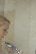 Naked girl takes a hot shower-13