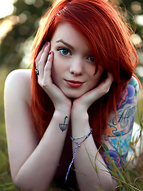 Tattooed redhead teen